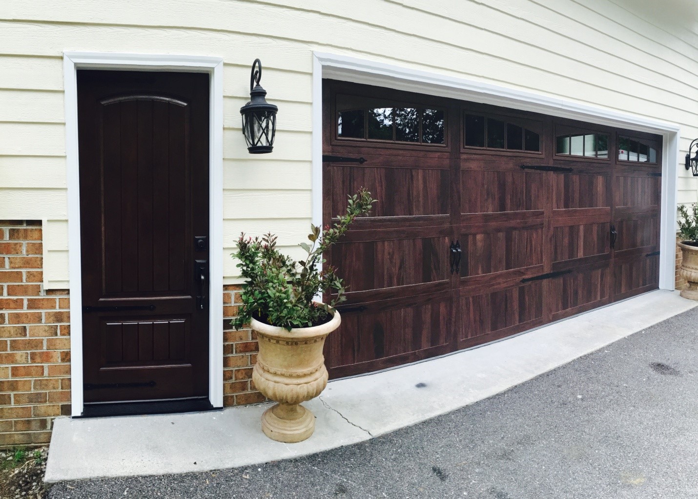 An Entry Door & Carriage House Garage Door Complement Each Other